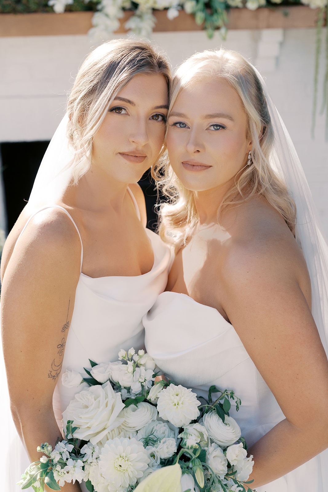 portrait of two brides at their north carolina lesbian wedding