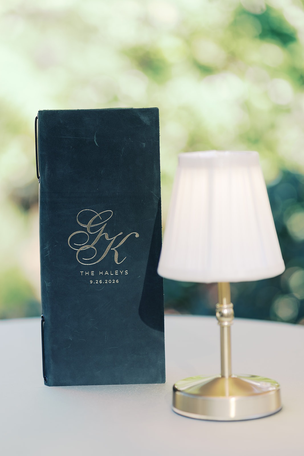 monogrammed wedding details and gold table lamp