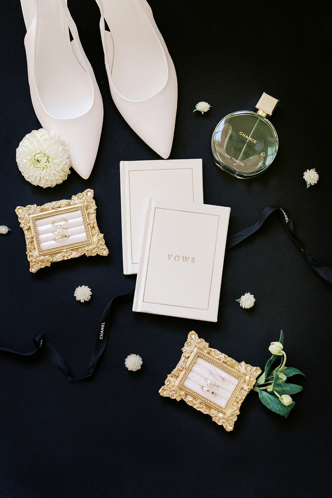 vow books, heels and ring boxes for two brides