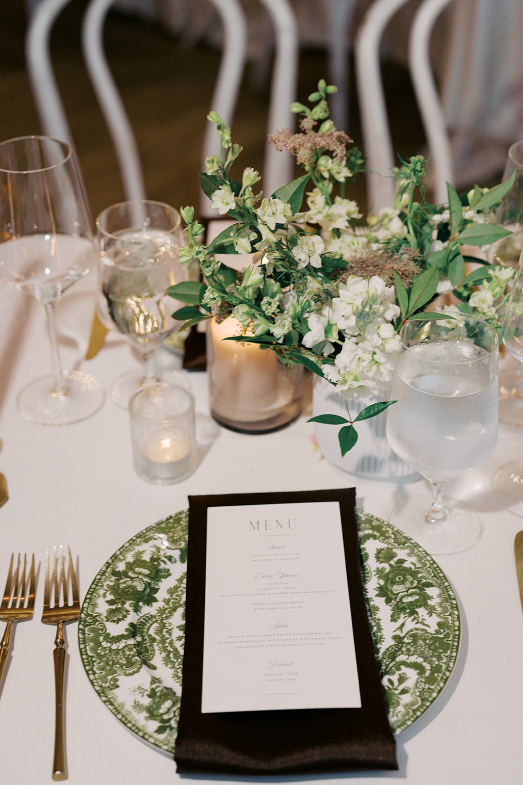 green toile charger and black napkin wedding place setting