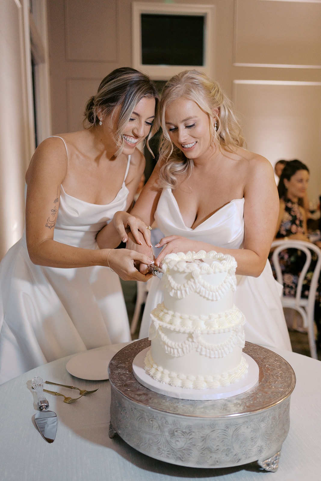 brides cutting their wedding cake by sugar euphoria