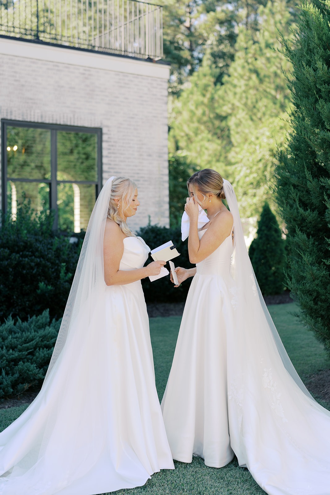 brides reading private vows during their first look in new hill nc